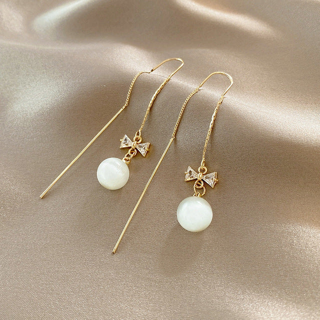 Aretes Colgantes de Lazo con Perlas en Oro